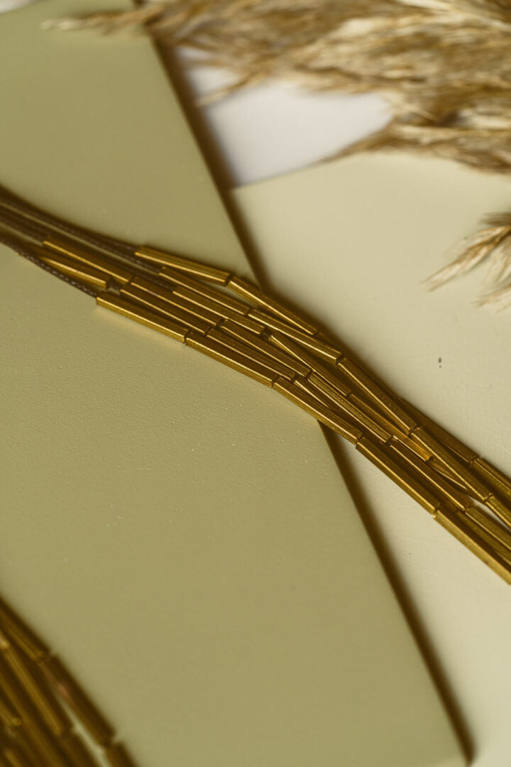 Multi-layered long brass tube necklace