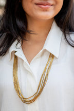 Multi-layered long brass tube necklace