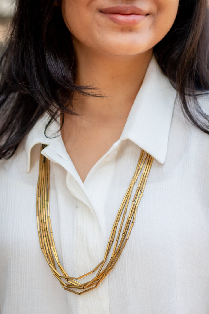 Multi-layered long brass tube necklace