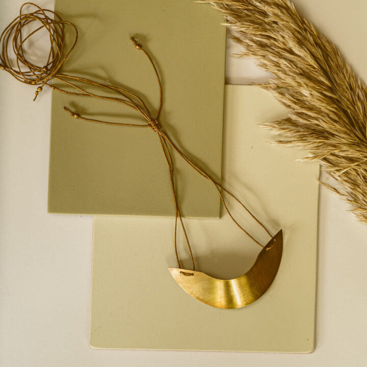 Curved semicircular brass neckpiece